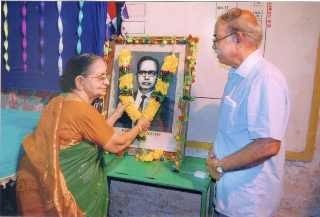 Smt B. Savitri Garu Garlanding Photograph
