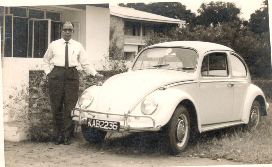 Sri B.R.K. Sastry standing near classic car